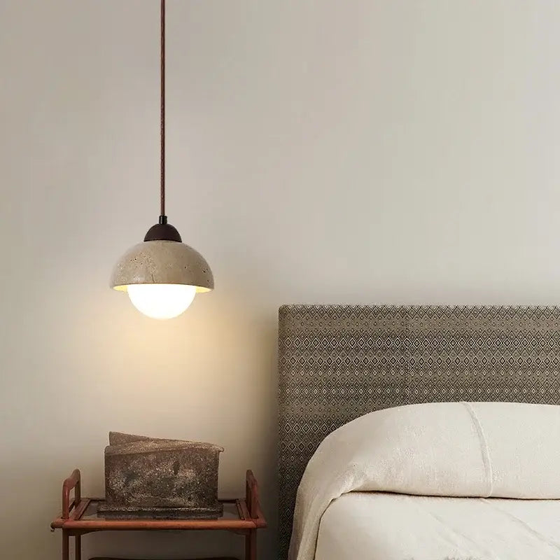 Warm textured concrete cave stone pendant light dining room