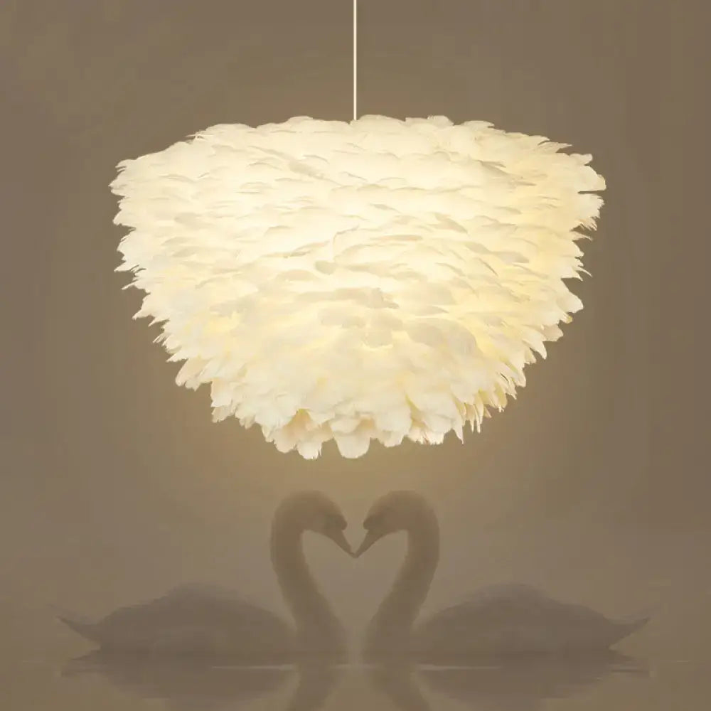 White floral pendant chandelier with feather accents for dining room