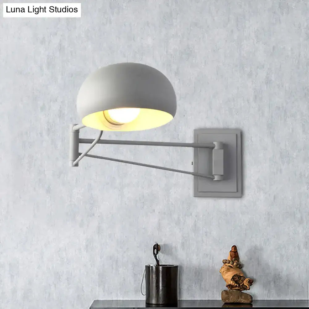 Yellow adjustable metal wall sconce with bowl shade for bedroom