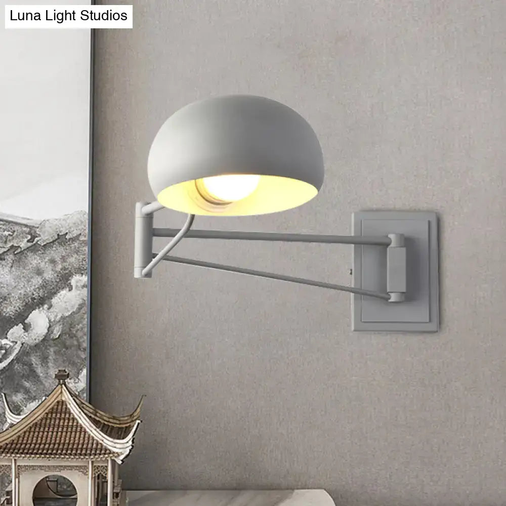 Yellow adjustable metal wall sconce with bowl shade for bedroom