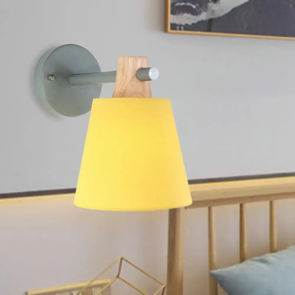 Yellow macaron fabric wall light with wood accent bedroom sconce