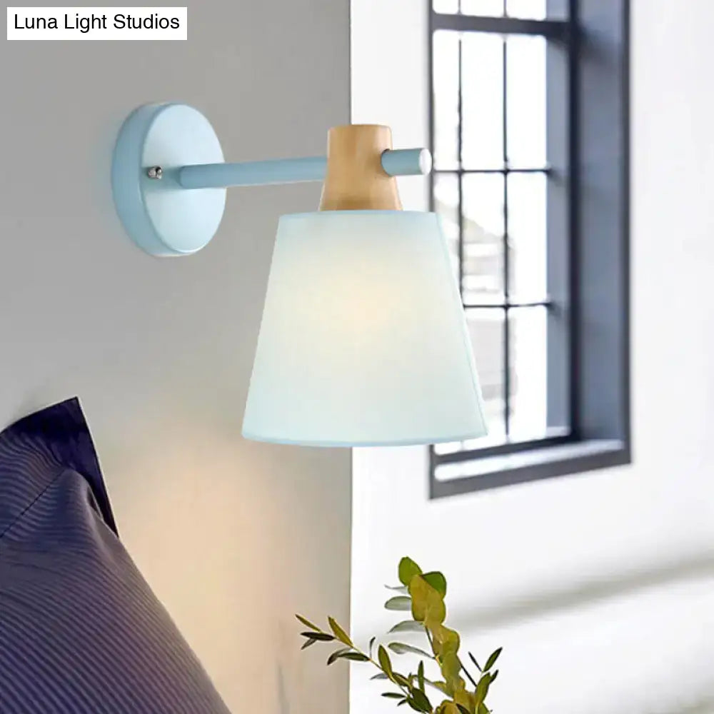 Yellow macaron fabric wall light with wood accent bedroom sconce